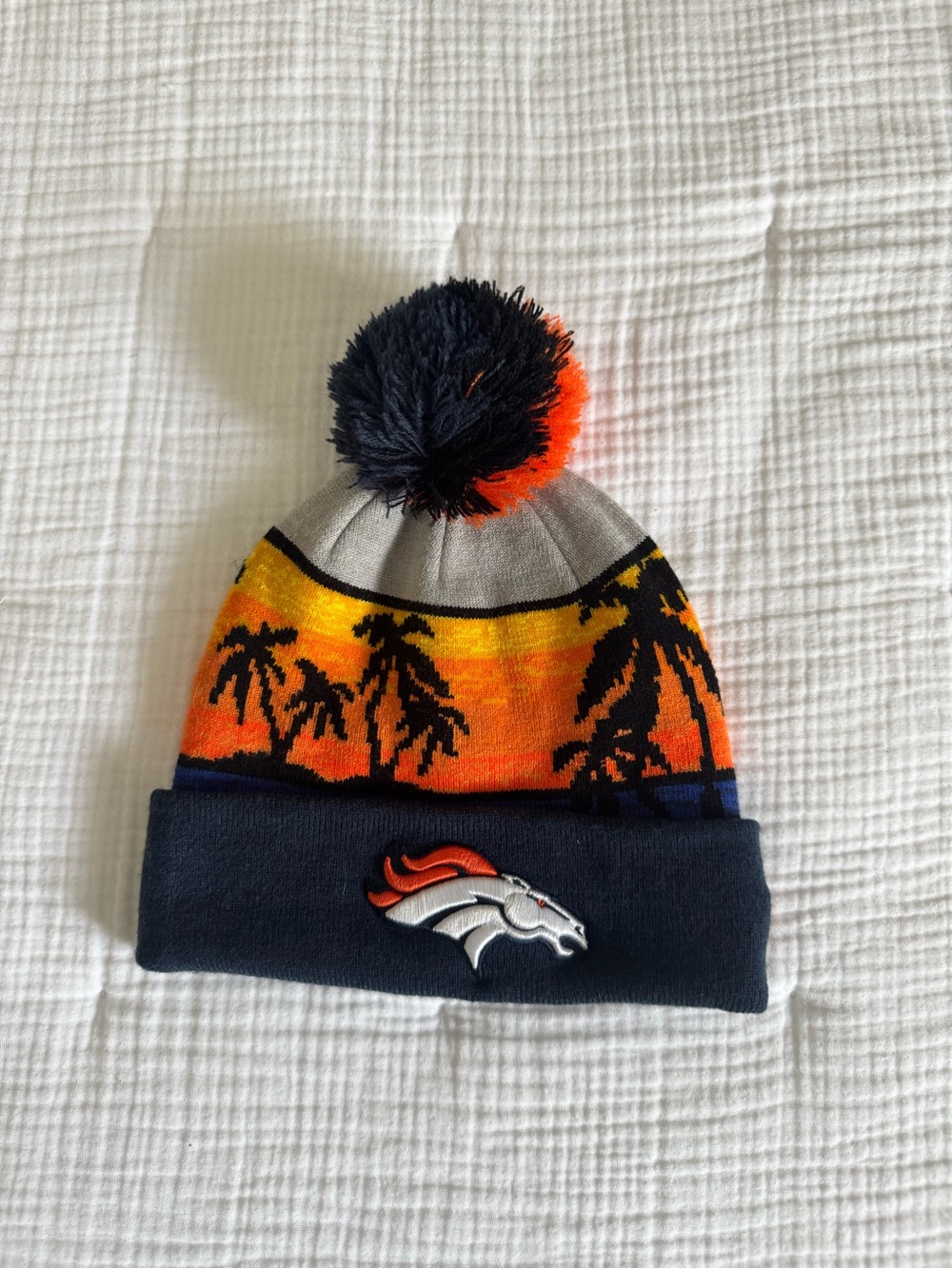 New Era Broncos Sunset Palm Pom Beanie in Navy, Orange, Yellow
